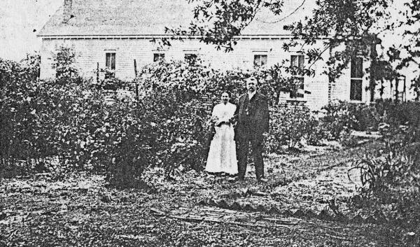 Mr. and Mrs. Lon Morris in their rose garden. Mr. Morris was a Pittsburg banker and Lon Morris College in Jacksonville, a Methodist institution, was named for him. The Morris home was located where the Pittsburg Service Station stood in later years, adjac The Morris’ Rose Garden