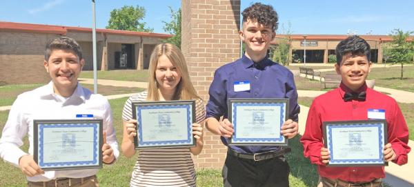 Winners are pictured (from left): Brian Ramirez, Maxime Risner, Cade Bennett, John G. Rodriguez COURTESY PHOTO Winners of annual McGraw Hill Poster Contest announced
