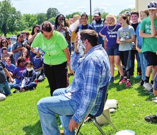 Intermediate students serve pies in the face