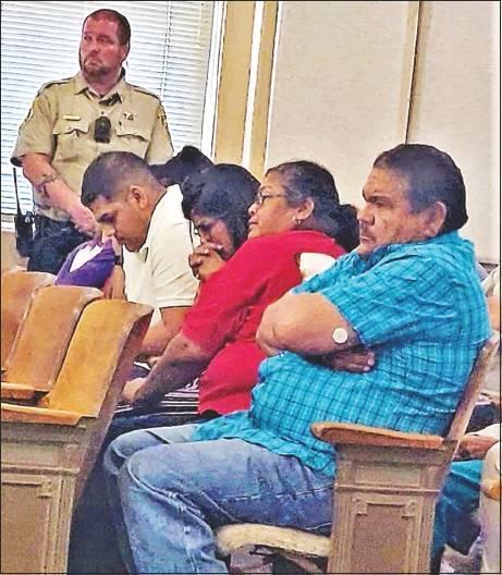 GAZETTE PHOTO / LYNDA STRINGER Luis Ramirez, in the white shirt, sits with his family in the 76th District Courtroom as they react after hearing the verdict of manslaughter against his sister, Leticia Ramirez, in her murder trial. Luis Ramirez and two oth Article Image Alt Text