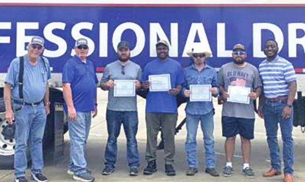 COURTESY PHOTO Professional Driving Academy graduates four students