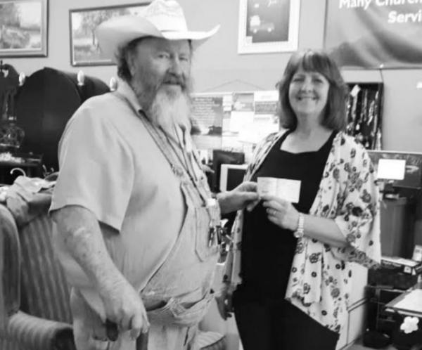 Gib Wilson donates $1,000 to God’s Closet/ Camp County Cares