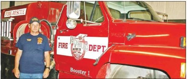 Pittsburg Fire Chief Carl Cravey stands in front of Booster 1, the inactive 1990-model fire engine that will be gifted to Thunderbird Point Volunteer Fire Department and put back into service in exchange for mutual aid to the city department. Article Image Alt Text