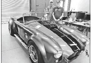 Tony Whitworth, left, and John Weatherly are pictured with the finished 427 Cobra kit car. Article Image Alt Text