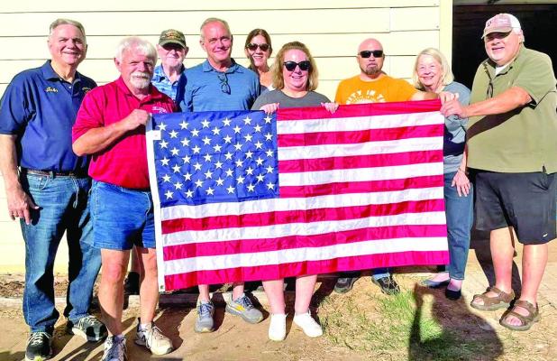 Rotarian Flag Project Committee preparing for distribution.