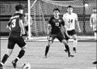 GAZETTE PHOTO / ELLIS KNOX The Pirates close on the Alumni goal as #3 Victor Benites, prepares to pass to team co-captain #13 Marco Trejo, as alumni #14 Efrian Cruz covers Trejo. Pirate Soccer routes Pirate Alumni, 5-1