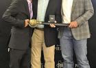Assistant Athletic Director, John Chatham, Pittsburg ISD Superintendent, retiring, Terry Waldrep, and Athletic Director John Huffstetler. They gave him a sword inscribed as “Mr Wladrep, in all ways a Pirate”, and an inscribed pocket watch.