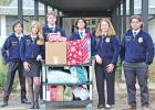 Left to right: Aiden Henninger, Landri Moore, Jacob Lindley, Edgar Villeda, Abby Osthoff, and Carlos Martinez GAZETTE PHOTO / ELIZABETH LANNING Pittsburg FFA delivers Christmas cheer