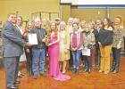 GAZETTE PHOTOS / ELLIS KNOX Chamber President James Wallace presents Century 21 Premier Group with the award for 2020 Business of the Year. Chamber of Commerce hosts annual banquet