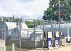 Before this project began, these large tanks were visible from the road and Barefoot Bay RV Park. COURTESY PHOTO Article Image Alt Text