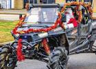 Santa rides in the parade to deliver toys to those in need. The parade was hosted by Mud Mafia ATV Club and was a huge success. COURTESY PHOTO / JERRY GOODALE Article Image Alt Text