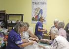 Blanketeers pack up blankets to be donated Covered in love, wrapped up in hope