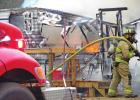 Firefighters worked to put out a camper on fire at Barefoot Bay. While no one was injured the camper was fully engulfed and beyond repair. GAZETTE PHOTO / HOLLY MCGONAGILL Camper catches fire at Barefoot Bay