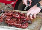 These Hot Links are being carefully prepared by Off Duty BBQ. (See page 14 for many more pictures.) GAZETTE PHOTO / ELIZABETH LANNING Stirring sights and sounds, and savory smells