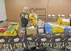 Lions Club members attended the Local School Supply Distribution held by God’s Closet at the Bleu Hen on Saturday August 6. Members assisted in the distribution of supplies to several local students and families in need. COURTESY PHOTO There for the community