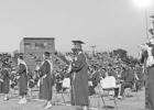 Graduating seniors show support for their classmates as they take the stage to receive their diplomas. PHOTO BY DI DUNCAN YEAR IN REVIEW