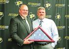 Assistant Superintendent Jonathan Hill was presented with the American Flag that had flown for over the high school for nearly ten years while he was HS Principal. Though worn, it was carefully folded and presented to him by current High School Principal Parker retiring from school board