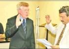 GAZETTE PHOTOS / LYNDA STRINGER City Attorney Mike Setty administers the oath of office to newly elected Mayor David Abernathy at Monday night’s City Council meeting. Article Image Alt Text