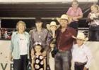Tervyn Armstrong, second from left, received the Jerald Smith Memorial Scholarship. From left, members of the Smith family Joan Smith, Armstrong and a family member, Payden Franks and his children. COURTESY PHOTO Rodeo Performers win Scholarship