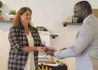 Past President Guy Cayo passes the gavel to the incoming president, Angela Saucier. GAZETTE PHOTO / ELIZABETH LANNING Beginning a new year with Rotary
