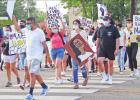 A protest was held in downtown Pittsburg on June 6. Approximately 30 local citizens came together in support of the Black Lives Matter movement. GAZETTE PHOTO / DI DUNCAN No justice, no peace