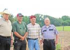 Left to right: Sheriff Cortelyou, Todd Busch, Larry Shrum, and Richard Huffman GAZETTE PHOTO / ELIZABETH LANNING Camp County inmates raise