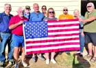 Rotarian Flag Project Committee preparing for distribution.