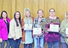 Right to left: Travis Moore, Dawn Kennington, and Heather Griffin presented Pirate Gold Awards to Jesi Buck, Kristal Farmer, Susan Gilbert, Kelly McGee, and Casie Yantis. COURTESY PHOTO Article Image Alt Text