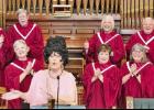 Shelley Aubrey as the face and voice of Polly Porter and members of the First United Methodist Church choir as the Praise His Name singers. COURTESY PHOTO Firefly Community Theatre presents “Packing Up Polly”