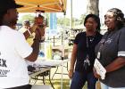 Kaymon Farmer videos two ladies during the annual Tailgate Party in Pittsburg. GAZETTE FILE PHOTOS Year in Review 2023
