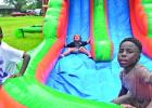 Big balloon bouncy house and water slide drew several children