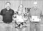 GAZETTE PHOTO / ELLIS KNOX The Pirate Gold Awards for Nov. were awarded to two of the Transportation employees, bus monitor Michelle Grant (center) and driver James Jones. The awards were presented by Transportation Director Kenneth Shelton. Shelton prais November Pirate Gold Awards