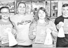 GAZETTE PHOTO / ELLIS KNOX The Camp County 4H chapter held an ice cream social and awards at Efurd Orchard’s roadside store. Receiving awards for completing their service record books, and being judged are Zoey Rozell, Agrilife Extension Agent Kaycee Da Article Image Alt Text
