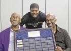 Left to right: Homer Jones, Kendal Wright, and Kenneth Reeves, Sr. are shown with a plaque presented to them in honor not only of their successful careers, but of their community service as well. GAZETTE PHOTO / ELIZABETH LANNING Douglass Alumni Center presents first annual fundraiser