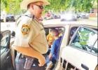 COURTESY PHOTO Former Camp County Sheriff’s Deputy Jim Carrigo shows off his patrol car during a community event in Pittsburg. Article Image Alt Text