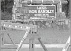 GAZETTE PHOTO / DI DUNCAN The entrance to Lake Bob Sandlin State Park has been closed with wooden roadblocks since the April 7 closure of all state parks. State parks, historical sites close, will offer refunds and extended passes