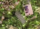 Several ornaments made of the newspaper “The Bethlehem Times” adorn this tree from the carol “Good Christian Men, Rejoice.” Sparkling exhibit showcases past and future Christmas prophecies