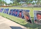 The senior photos cover three sides of Pilgrim Plaza in downtown Pittsburg. Pilgrim Bank sponsors tribute to graduates