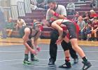 PISD wrestling team muscles their way to victory