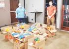 Social Work Club members Tonya Hammonds and Brent Garrett prepare for curbside delivery at the Eagle Pantry on Thursday. COURTESY PHOTO Social Work Club members Tonya Hammonds and Brent Garrett prepare for curbside delivery at the Eagle Pantry on Thursday. COURTESY PHOTO