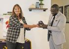 Incoming President Angela Saucier presents a gift of appreciation to Guy Cayo who served as president of the club for the past year. GAZETTE PHOTO / ELIZABETH LANNING Beginning a new year with Rotary