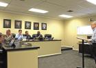 Wayne Owen (right) presents to the City Council. GAZETTE PHOTO / MOLLIE MCCLANAHAN Wayne Owen with NETMWD discusses budget for the water district