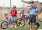 Carter and Parker Searcy, ages 8 and 6 respectively, dressed their bikes in red, white and blue with a little silver for sparkle. Patriotic bikers