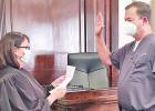 District Judge Angela Saucier swears Dr. Rodney Burrow into his new position on the Texas Board of Criminal Justice. COURTESY PHOTO Dr. Rodney Burrow appointed to Texas Board of Criminal Justice