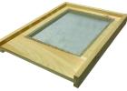 Hardware cloth stapled to this hive board allows air to circulate easier through the hive. It’s Hot!
