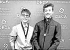 Layton Hood (L) and Drew Lawton earned a first-place medal for one of their role plays. Pitt DECA attend Mock DECA competition