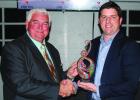Joe Harwell was presented the Dr. P.A. Reitz Memorial Man of the Year by Chamber President James Wallace. COURTESY PHOTO Annual Chamber Banquet lauds community members