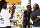 Kaymon Farmer videos two ladies during the annual Tailgate Party in Pittsburg and asks them what makes Friday Night Lights special to them personally. GAZETTE PHOTO / ELIZABETH LANNING Local entrepreneur plans documentary featuring Friday Night Lights