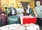 From Left: Lecia Bowman, chief nursing officer; Robin Davis, clinical/operational manager for pediatrics; Janet Kats; Vicki Briggs, CEO; and Greg Kats display some of the handmade creations that were donated to the hospital Wednesday. Couple donates creations to help