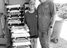 COURTESY PHOTOS Woody Ray and his wife Karen beside parts and pieces ready for the next level of assembly. Pittsburg volunteers build for Mobility Worldwide